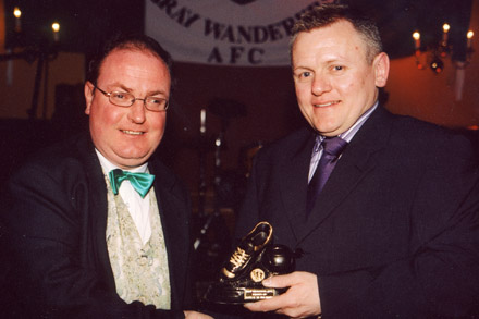 Declan Crinion accepts a 200-appearances award for Philip Keogh